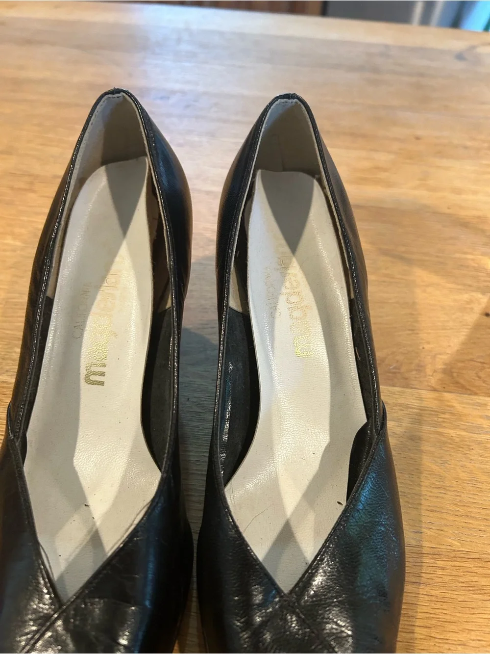 Black Leather Pointed-Toe Wedge Pumps